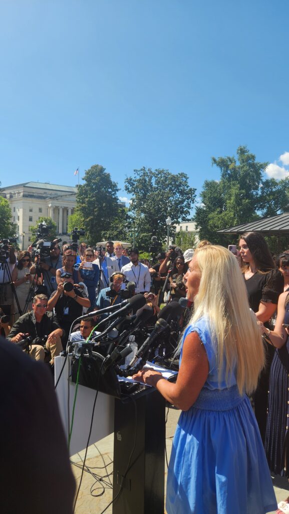 Representative Marjorie Taylor Greene (R-GA) speaks at a press conference with Epstein victims outside the Capitol.
