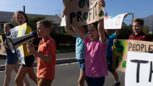 K-12 students protesting the Department of Education restructuring with the Department of Justice.